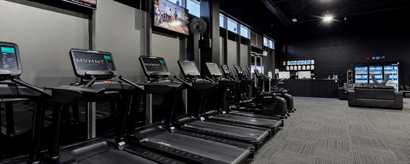 Cardio training area with personal screens at MVMNT